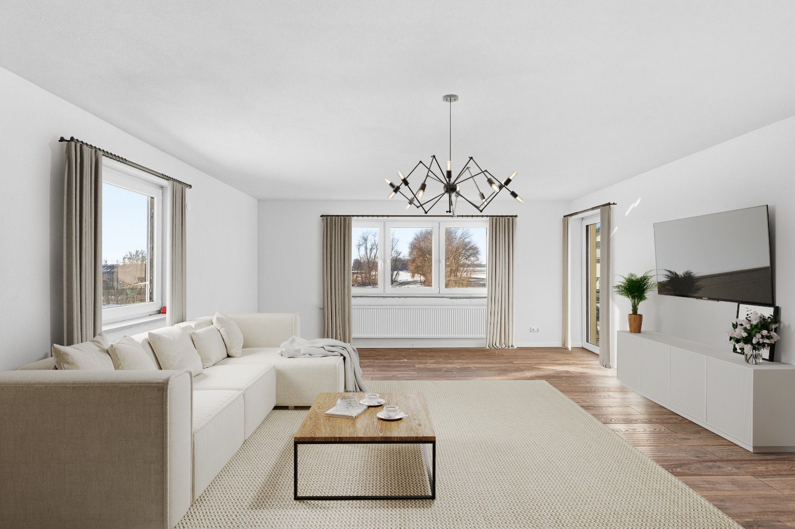 Wohnzimmer mit Sofa, Couchtisch und TV nach Virtual Staging